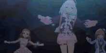 a group of anime girls are standing next to each other on a stage .