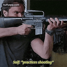 a man is holding a gun in his hands and says `` saif practices shooting '' .