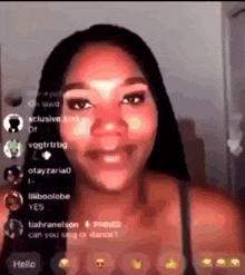 a woman is smiling while talking on a video call with a bunch of followers .