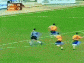 a soccer game is being played with a scoreboard in the background that says pel gale 0