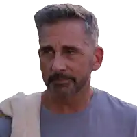 a man with a beard is wearing a blue shirt and a white towel around his shoulder