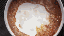 a bowl of food with a white circle in the middle of it