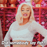 a woman says did somebody say fish in a white crop top