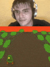 a man wearing headphones looks at a cartoon of a car going down a dirt road