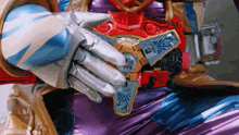 a close up of a person holding a toy that looks like a sword
