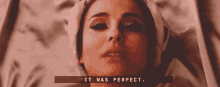 a close up of a woman laying on a bed with a towel on her head and the words `` it was perfect '' .