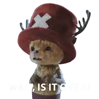 a stuffed animal wearing a red hat with antlers and the words wait is it over