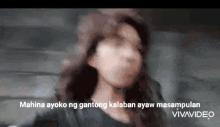 a blurred image of a woman with the words " mahina ayoko ng gantong kalaban ayaw masampalan " on the bottom