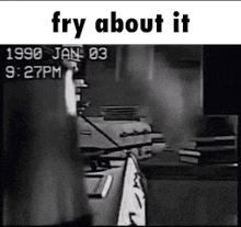a black and white photo of a person standing in a kitchen with the words `` fry about it '' written on it .