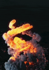 a fire explosion with smoke coming out of it on a black background .