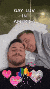 two men laying on a bed with the words gay luv in america