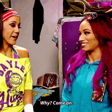 two women are standing next to each other and one of them is asking the other why come on