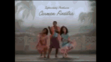 a group of people are dancing in front of a sign that says carmen finestre