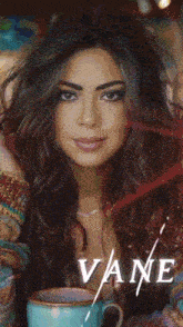 a picture of a woman with green eyes and the name vane