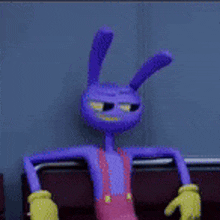 a purple rabbit with yellow gloves is sitting in a chair .