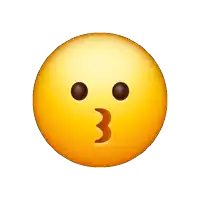 a smiley face is blowing a kiss with a pink heart in front of it