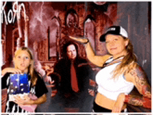 a group of people posing for a picture with korn on the background