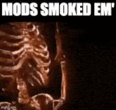 a skeleton is smoking a cigarette with the words mods smoked em on the bottom
