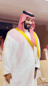 a man in a white robe with a yellow stripe on the sleeves