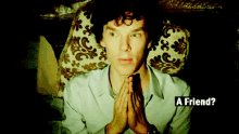 a man sitting in a chair with his hands folded and the words " a friend " below him