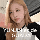 yunjin es de guada is written on a picture of a girl with blonde hair