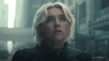 a close up of a woman 's face with thunderbolts written on the bottom right