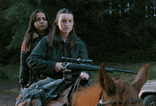 two girls are standing next to each other and looking to the side