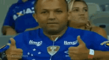 a man wearing a blue shirt that says limo on it
