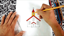 a person is drawing a church with a ruler and pencil