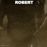 a man with a beard is wearing a black jacket with the name robert on it