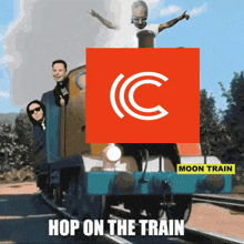 a group of people riding on a train with a moon train logo on the front