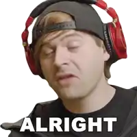 a man wearing headphones and a hat says " alright " on a white background