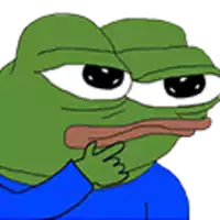 a green frog with a blue shirt on is making a funny face .