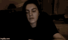 a person is sitting on a couch with their eyes closed and the website imgflip.com is in the corner