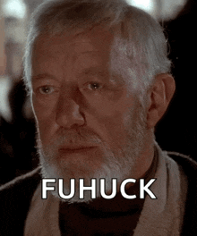 a man with a beard and the word fuhuck on the bottom