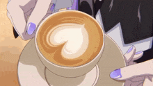 a cup of cappuccino with a heart shaped foam