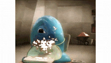 a cartoon character is eating a piece of cake