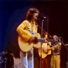 Playing The Guitar George Harrison GIF - Playing The Guitar George Harrison Any Road Song GIFs