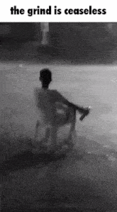 a black and white photo of a person sitting in a chair with the caption the grind is ceaseless
