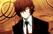 a man with a bandage on his face is wearing a black suit and tie