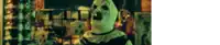 a blurred image of a clown in a white mask