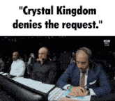 two men sitting in front of microphones with the words " crystal kingdom denies the request " above them