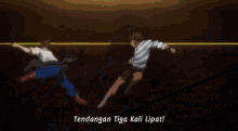a man in a striped shirt is kicking another man in a blue shirt