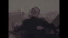 a man in a black turtleneck is sitting on a couch with the words i pociachane serce written in yellow