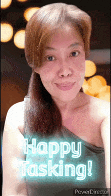 a woman is smiling and says happy tasking