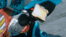 a close up of a robot 's arm holding a card