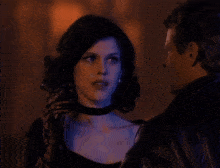 a man and a woman are standing next to each other