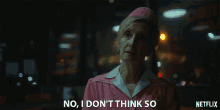 an older woman in a pink uniform says no i don 't think so