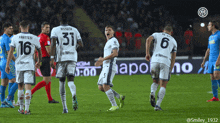 a group of soccer players are on a field and one has the number 6 on his back