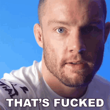 a close up of a man 's face with the words that 's fucked below it